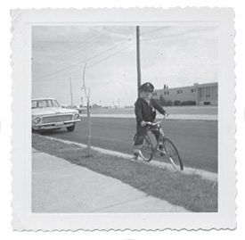 Young Ralph in front of his house